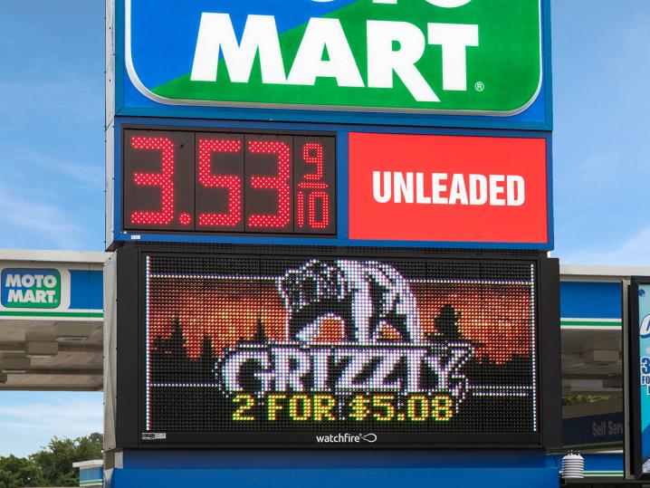 Some gas stations combine digital price signs with outdoor LED signs to attract customers.